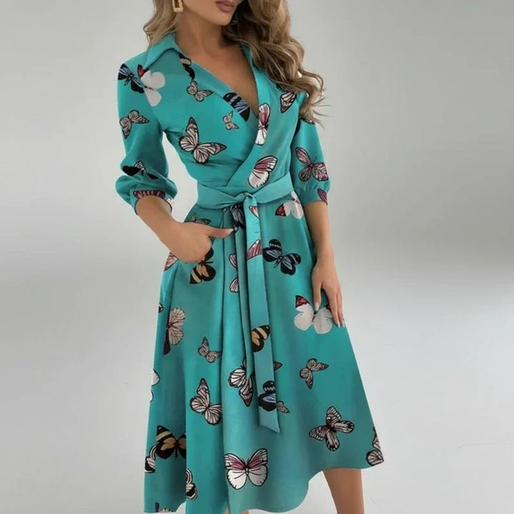 Casual women's 3/4 sleeve midi dress. Belted A-line design, V-neck. Versatile for work or summer days.