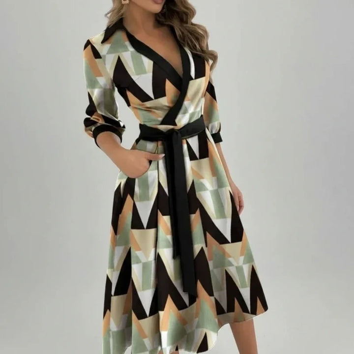 Comfortable and elegant women's midi dress. Belted A-line style, V-neck, perfect for summer casual or day wear.