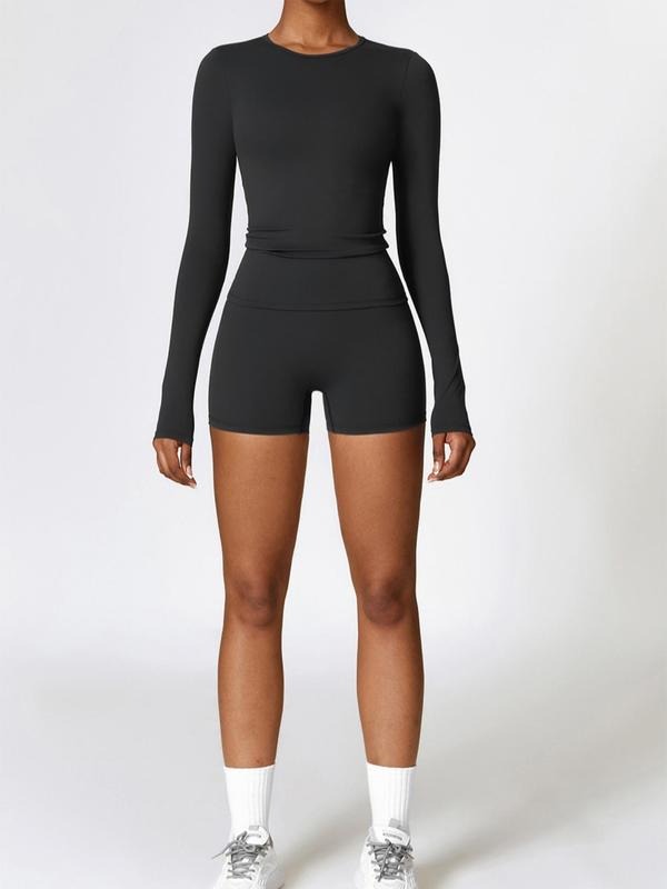 Stylish women's black gym set featuring a supportive crop top and comfortable high waist shorts.