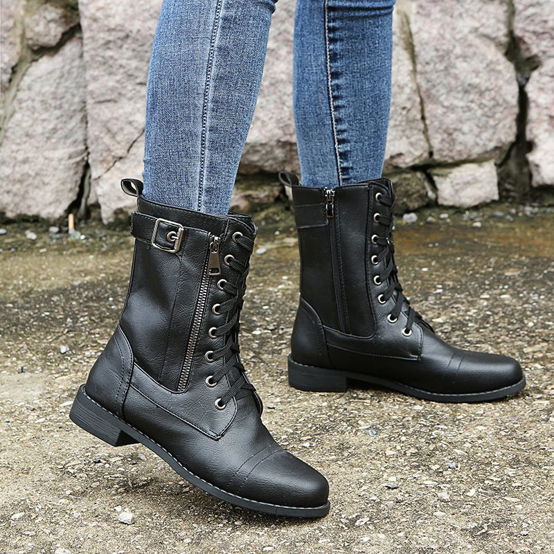 Top-down view of women's rugged combat boots, showing the lacing and side zip detail, ideal for winter.