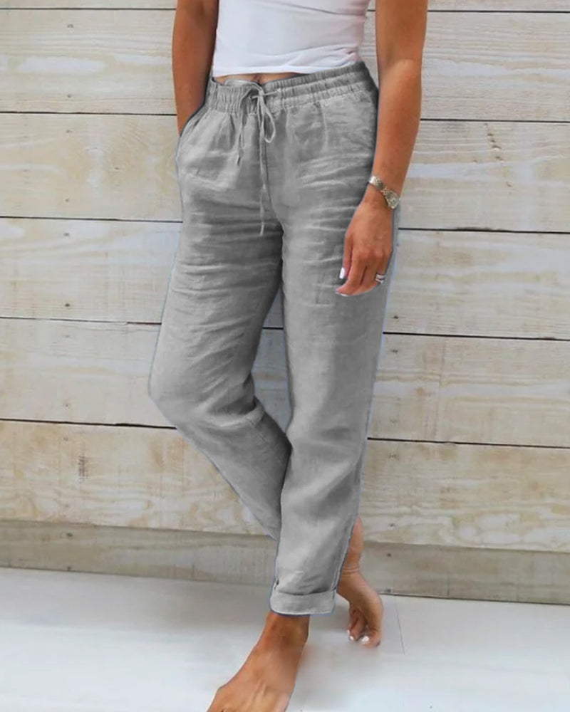 Lightweight women's straight leg trousers with drawstring elastic waist for versatile, breathable spring fashion.