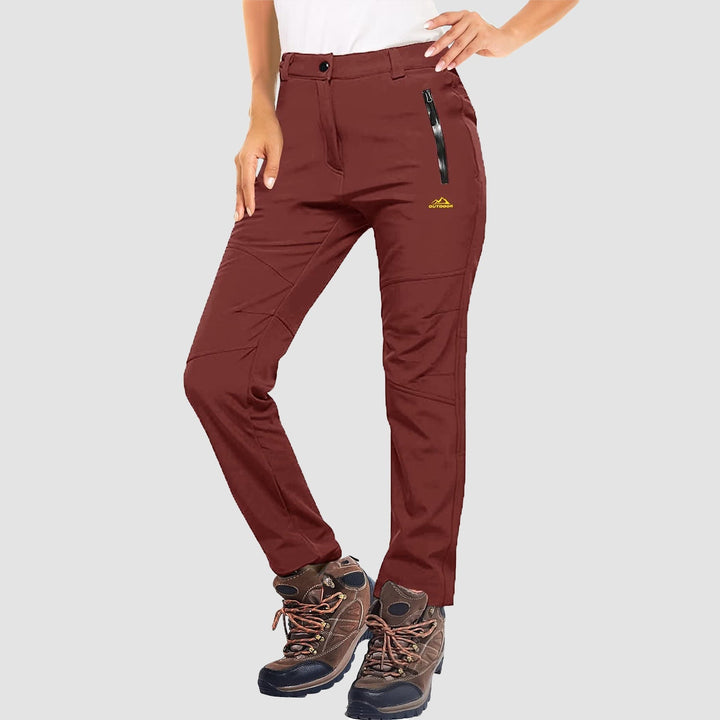 Front view of women's athletic winter pants, black softshell with fleece insulation