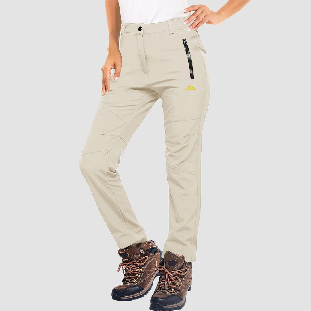 Close-up of women's grey softshell ski pants, showing fleece lining and fabric texture