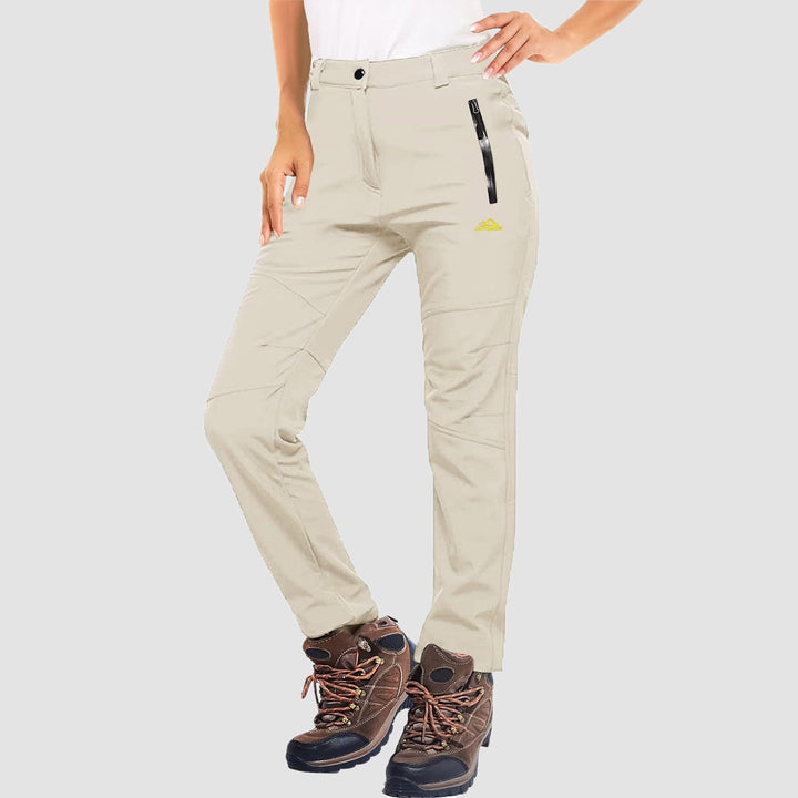 Close-up of women's grey softshell ski pants, showing fleece lining and fabric texture