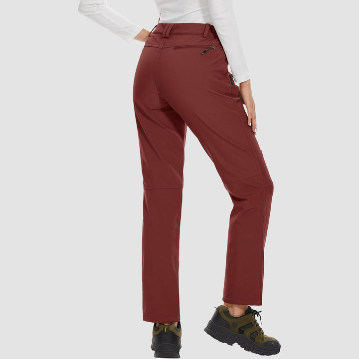 Detailed shot of the ankle cuff and zipper on women's black fleece-lined ski pants