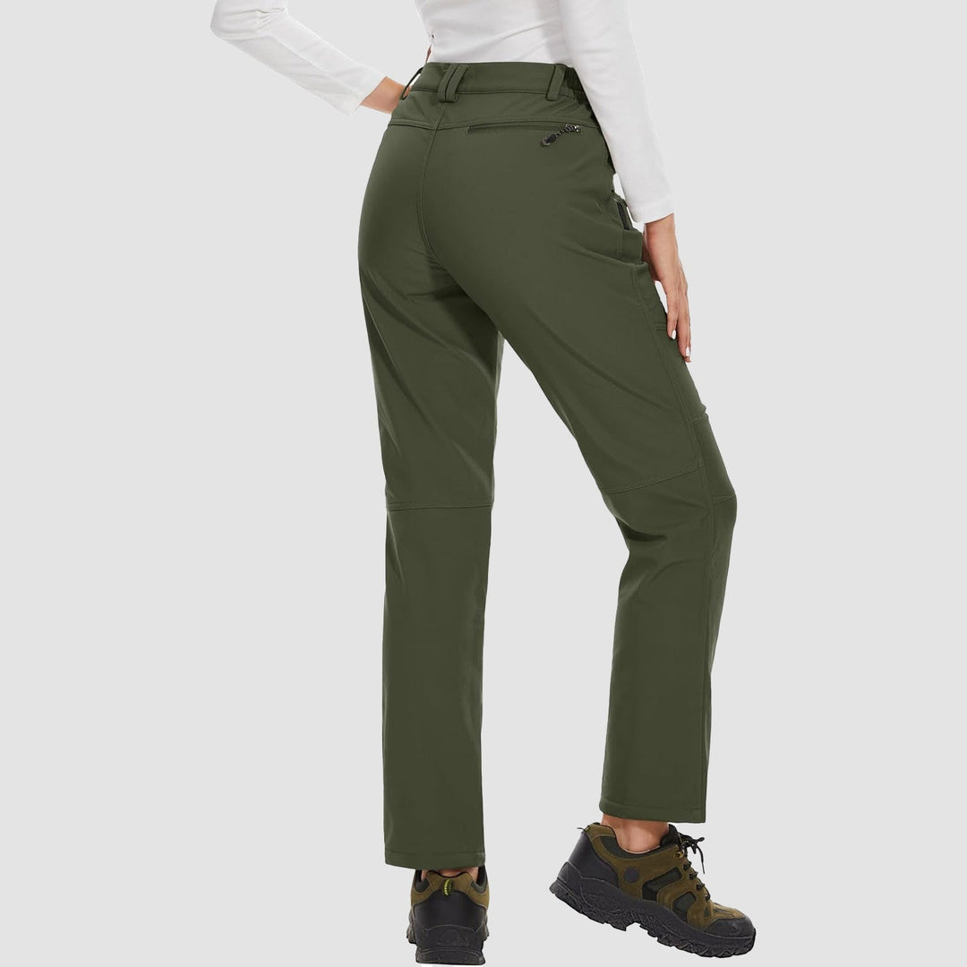 Stylish women's grey softshell ski pants, fleece-lined and water-resistant for snowy days