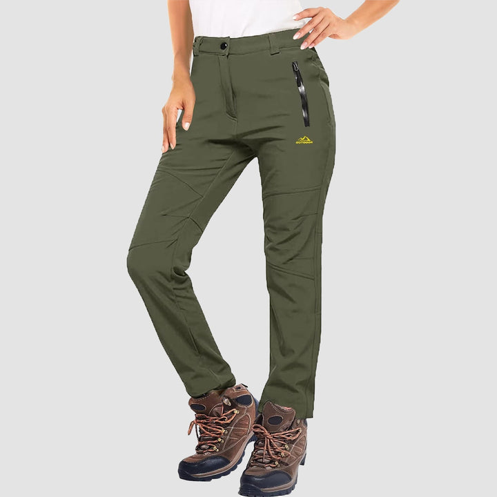 Detailed shot of the water-resistant fabric on women's softshell ski pants, light grey