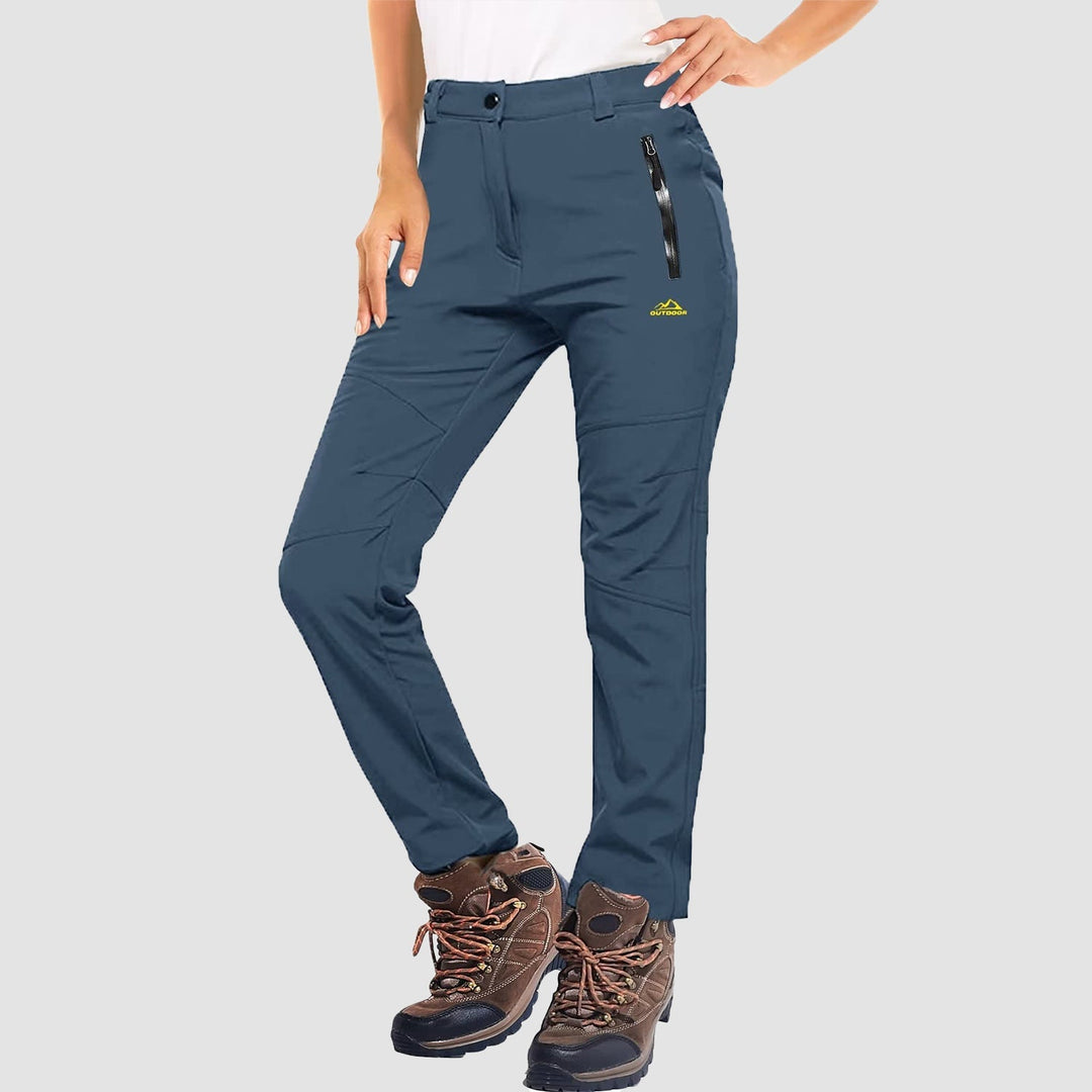 Pair of women's purple ski pants, softshell material with a cozy fleece lining