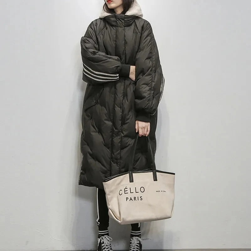 Women's black long insulated padded jacket, providing cozy warmth and stylish protection in winter.