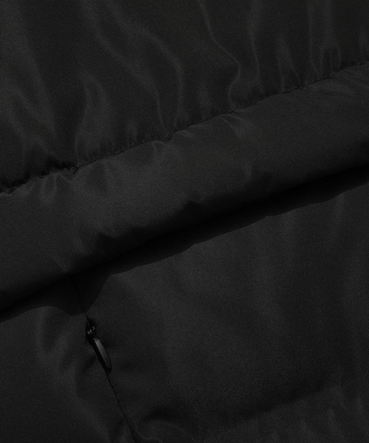 Back view of a women's insulated black parka, showcasing its length and winter readiness.