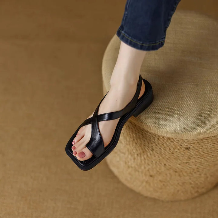 Stylish women's leather cross strap comfort sandals, perfect for versatile summer outfits