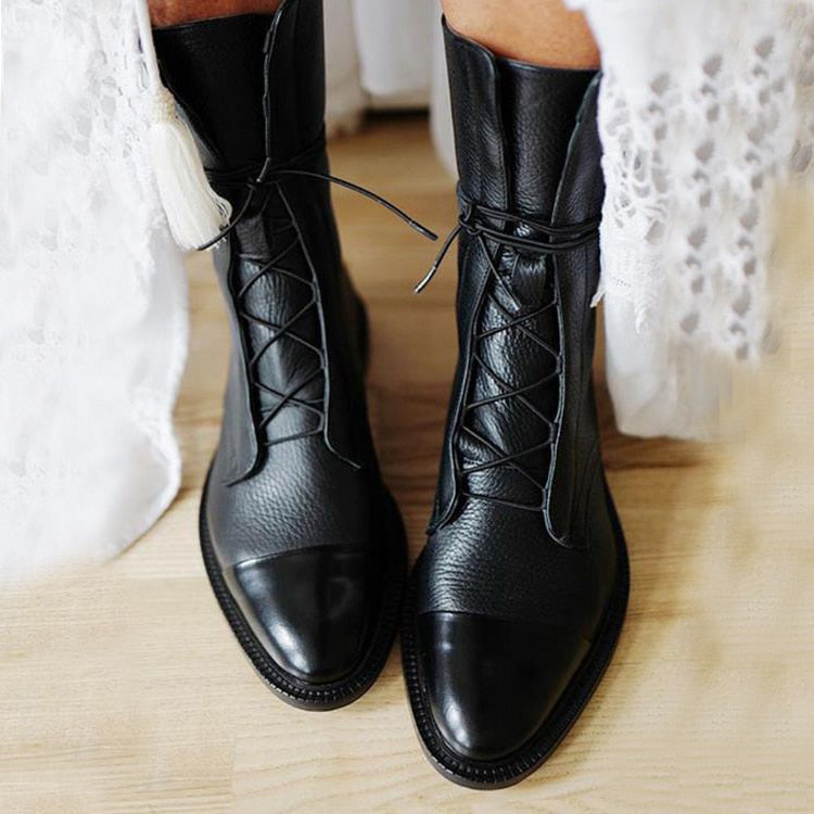Women's black leather lace-up ankle boots with sturdy sole, ideal for fall & winter fashion.