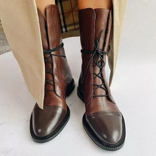 High-quality women's leather boots, lace-up, showcasing their durable sole and classic style.