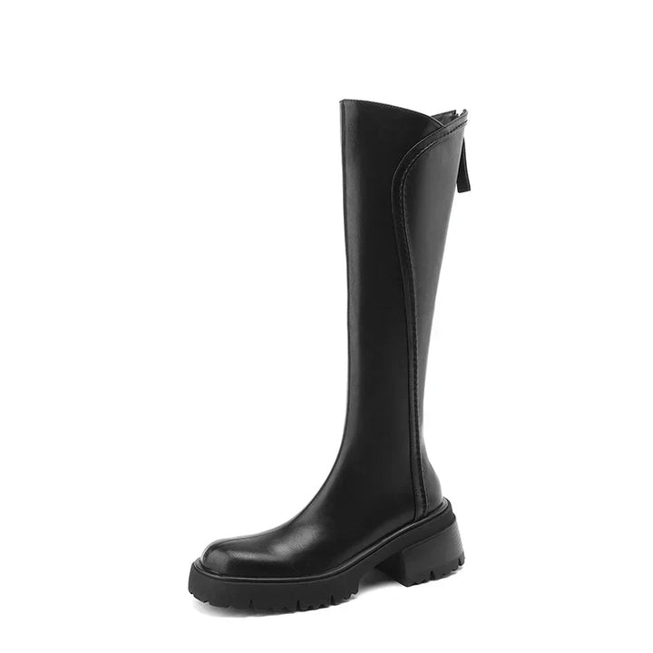 Orthopedic women's black leather boots, back view, showcasing knee-high design and quality feel
