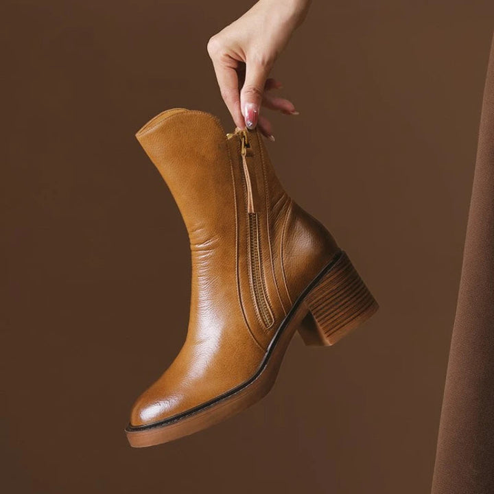 Women's black leather zip ankle boots, block heel, side view for autumn/winter fashion