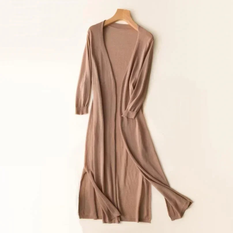 Side view of a white women's longline cardigan, showcasing its elegant relaxed fit