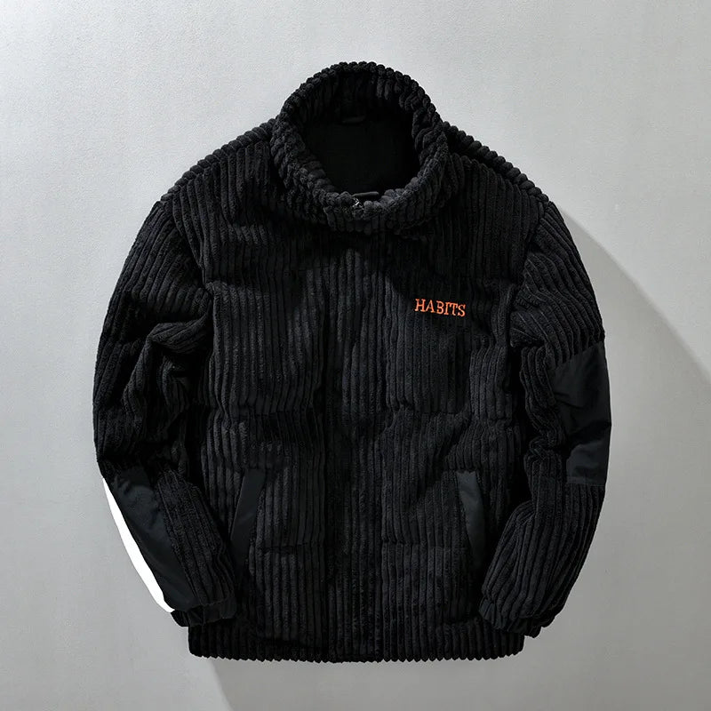 Stylish women's quilted corduroy winter jacket in black, perfect for cold weather