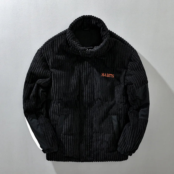 Stylish women's quilted corduroy winter jacket in black, perfect for cold weather