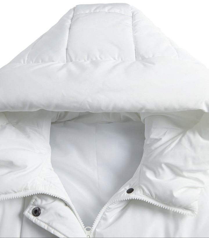 Women's warm quilted puffer vest, extended length for added coverage and style.