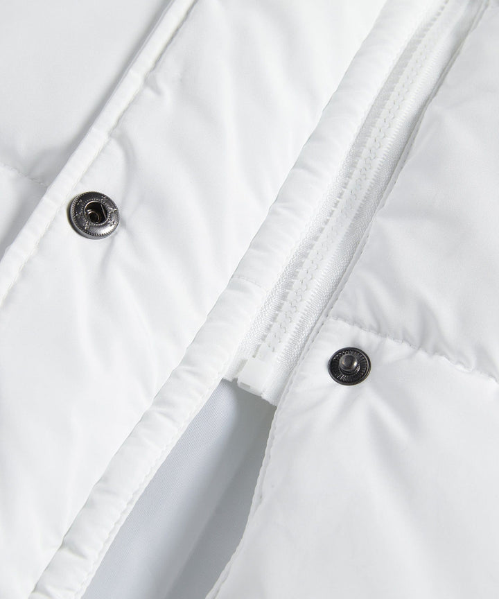 Cozy women's quilted vest, longline cut for warmth and contemporary winter style.