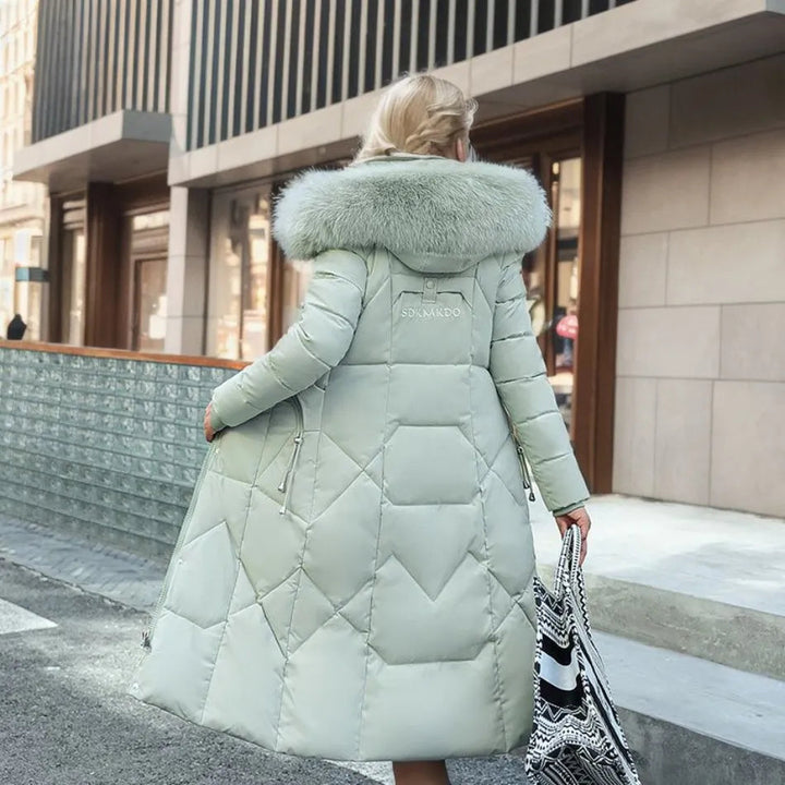 Women's winter fashion: dark quilted long coat with a practical and stylish hood