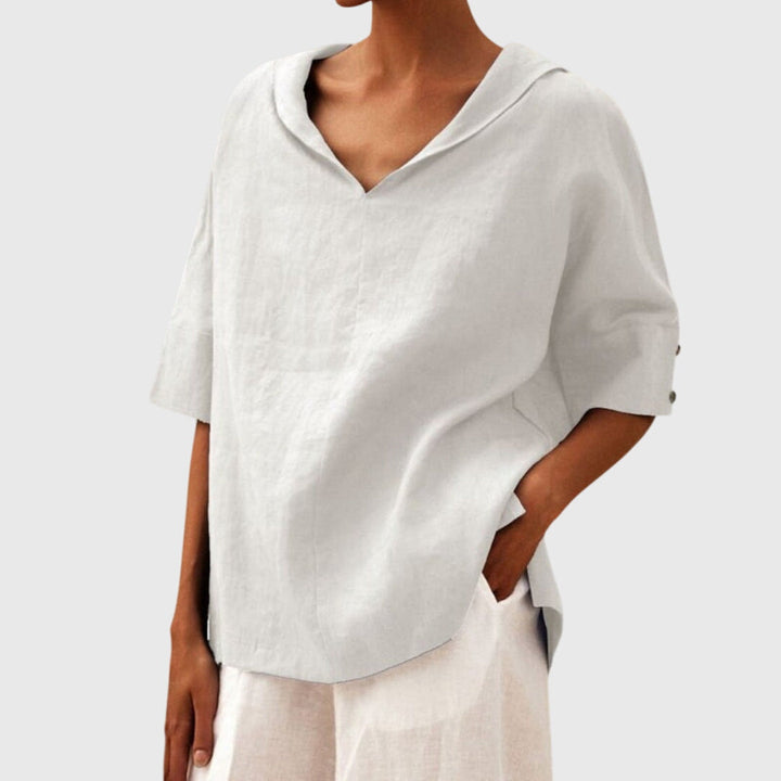White relaxed fit women's blouse, comfortable long sleeve top. Ideal for casual everyday fashion apparel.
