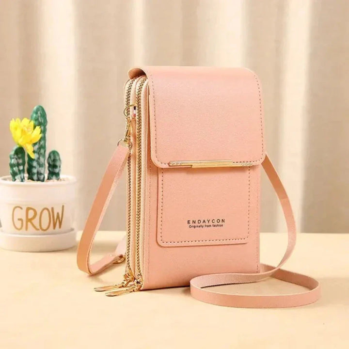 Versatile women's touch screen shoulder bag, functions as a phone purse & travel accessory.