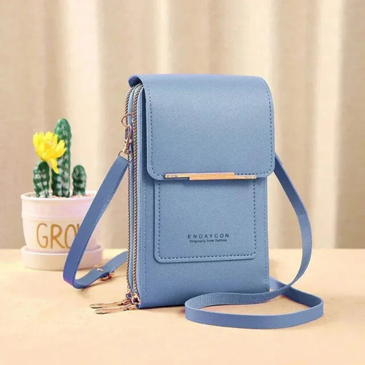 Secure women's touch screen phone bag, a crossbody design allowing safe & easy smartphone access.
