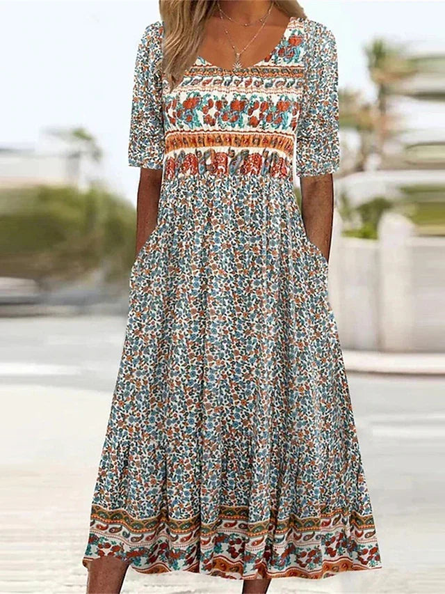 Women's boho print midi dress with a gathered waist & practical pockets, perfect for summer casual wear.