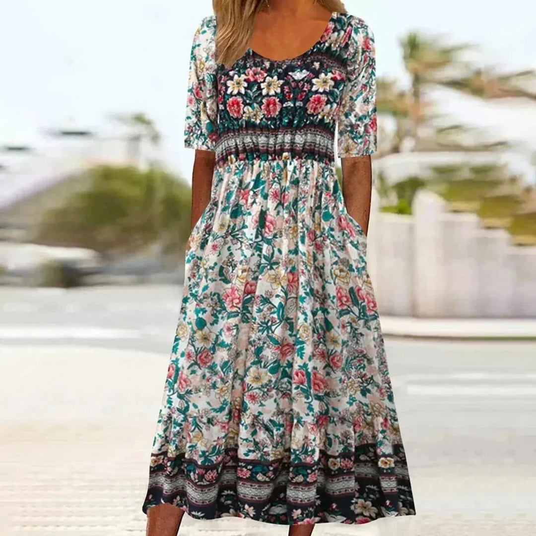 Elegant women's boho midi dress with an eye-catching print, gathered waist, and functional pockets for everyday wear.