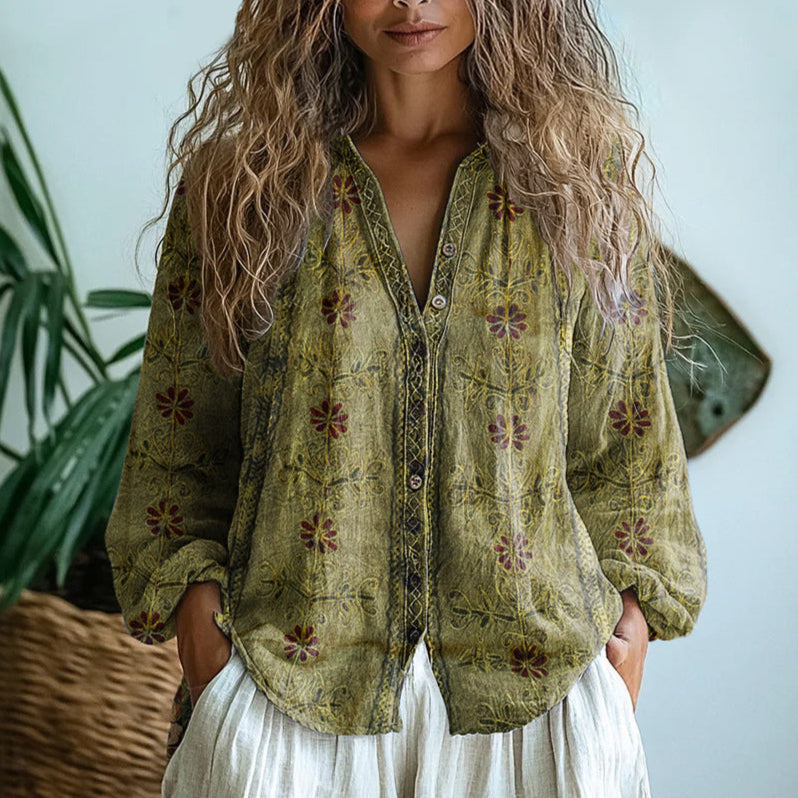 Loose fit bohemian women's blouse with a vibrant vintage floral print and comfortable long sleeves.