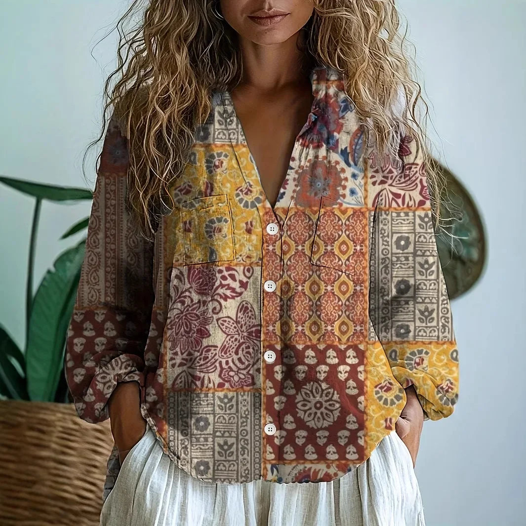 Bohemian women's vintage floral blouse featuring a charming patchwork print and relaxed fit.