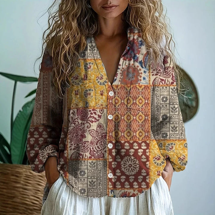 Bohemian women's vintage floral blouse featuring a charming patchwork print and relaxed fit.