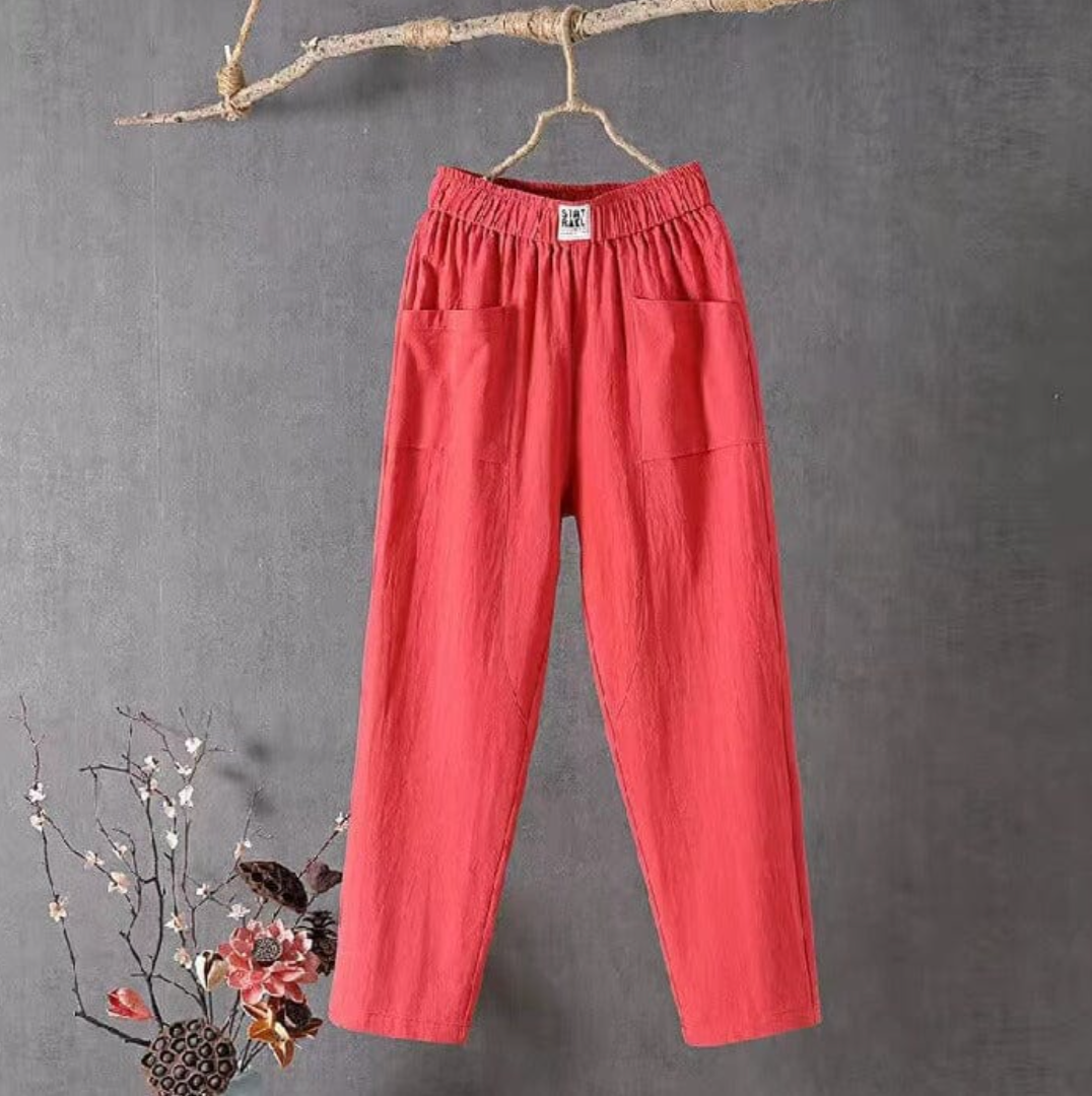 Comfortable women's high-waist pull-on pants with practical patch pockets, ideal for warm weather.