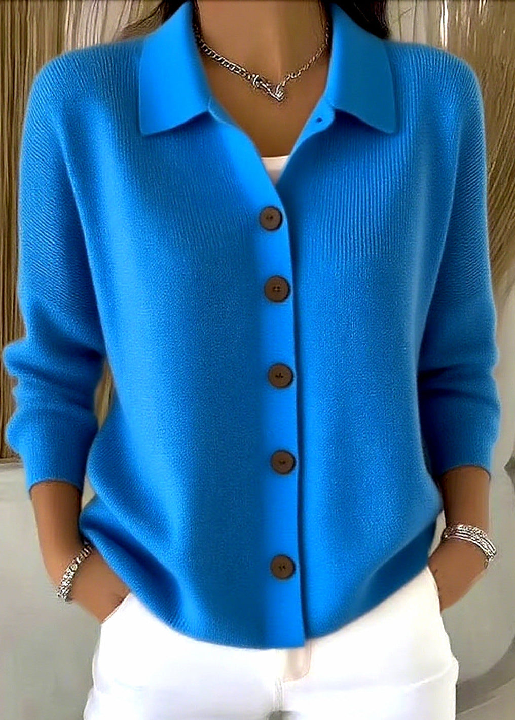 Sophisticated women's button down top: a cardigan sweater with a refined shirt collar for office attire.