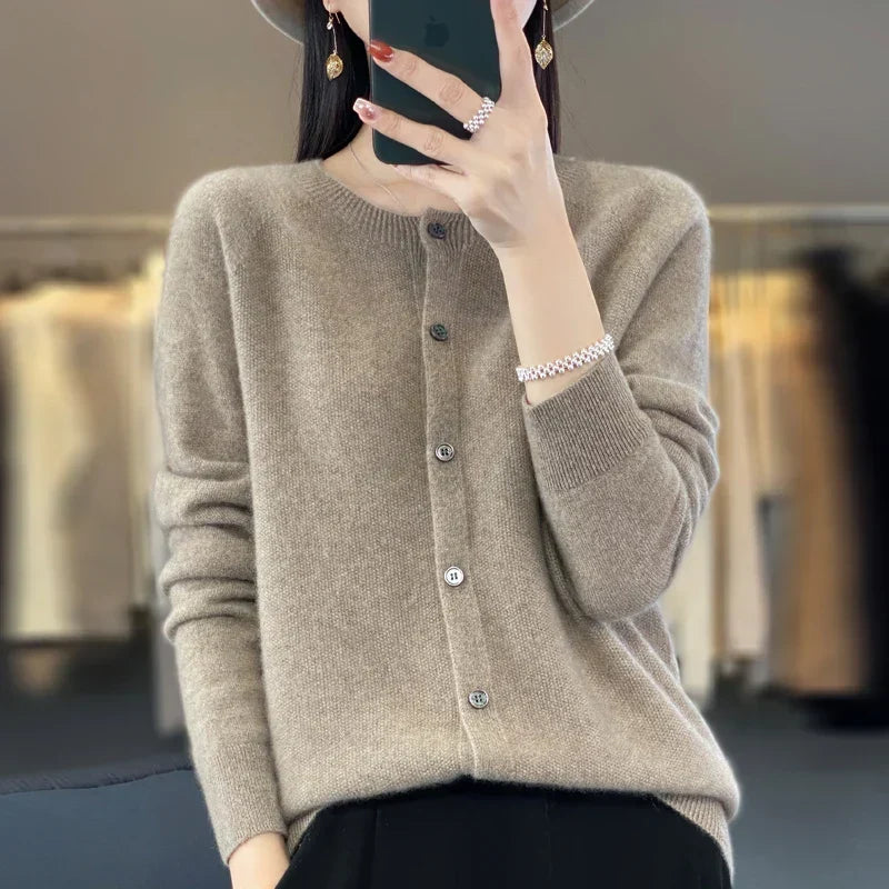 Elevate your look with this versatile women's button front knit cardigan. Long sleeve, round neck layering.