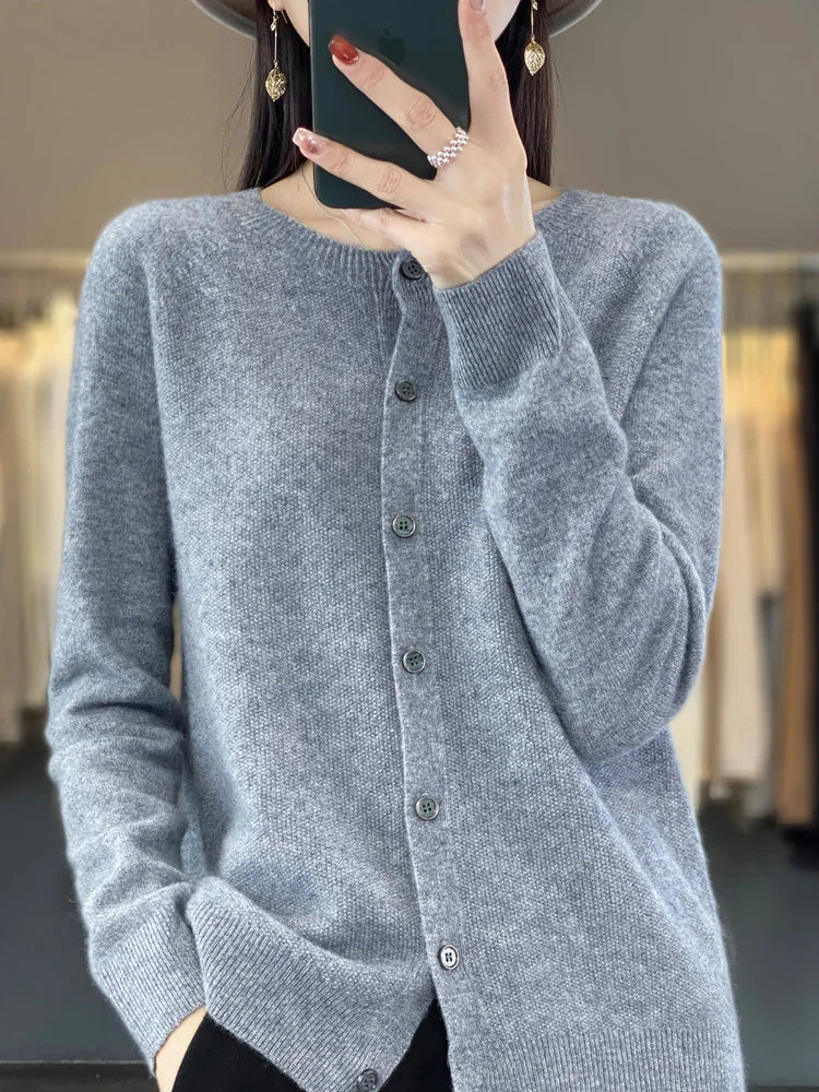 Cozy women's knit cardigan with button front, long sleeve, and round neck. Perfect fall & winter layering.