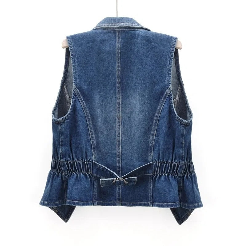 Fashionable women's sleeveless open-front denim vest, a versatile layering piece for casual wear.