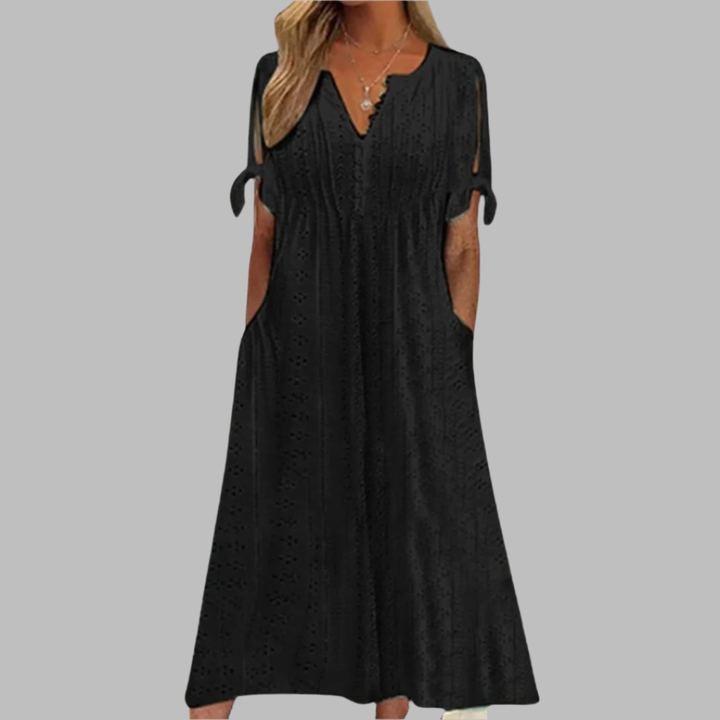 Feminine eyelet boho midi dress for women, featuring a V-neck, tie-sleeves, and pockets, ideal for garden parties.