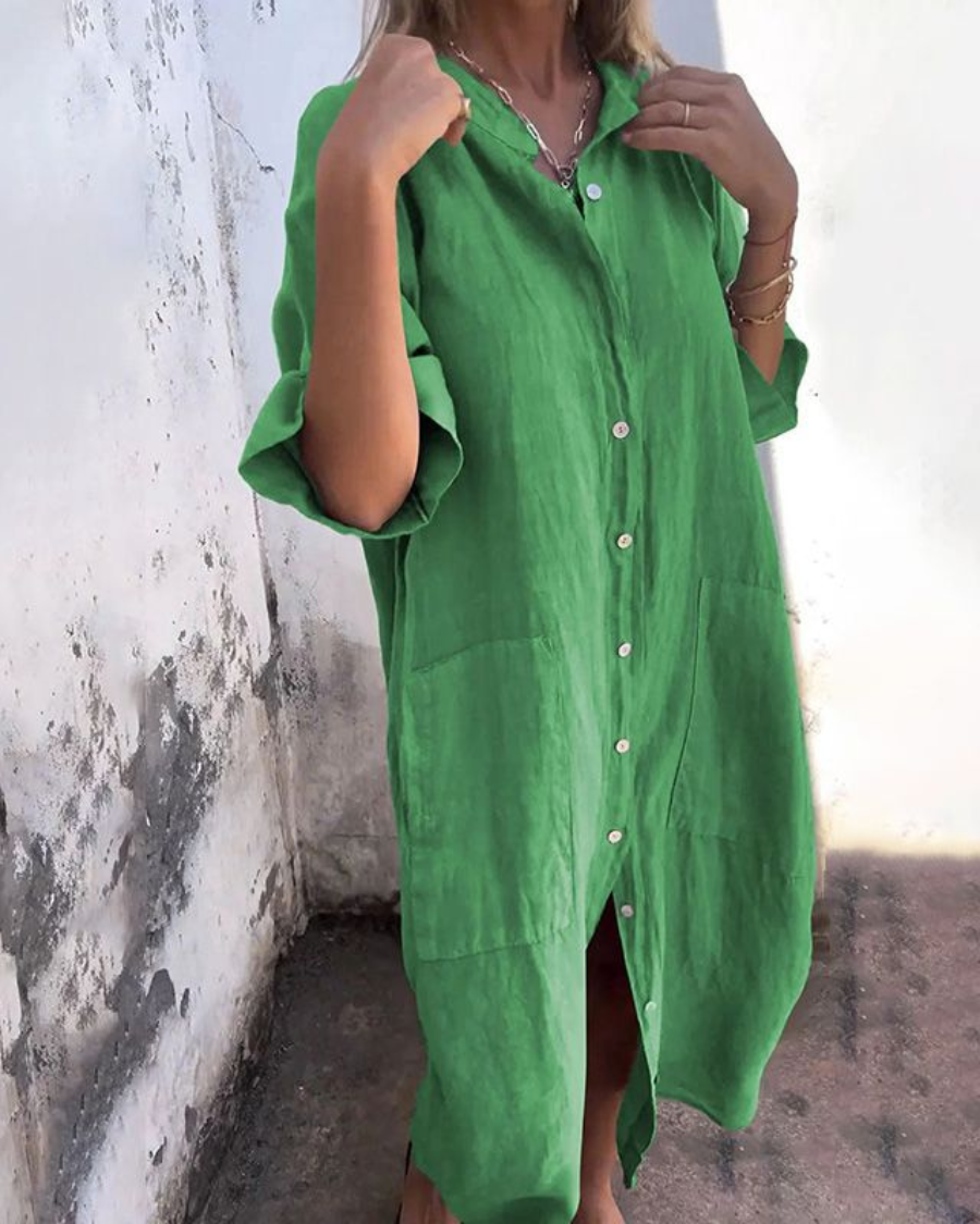 Stylish short-sleeve button-front dress for women. Comfortable relaxed fit, ideal for casual occasions.
