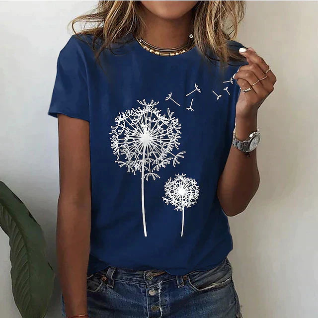 Model wearing a women's short sleeve dandelion graphic t-shirt, showcasing its relaxed fit & casual style.