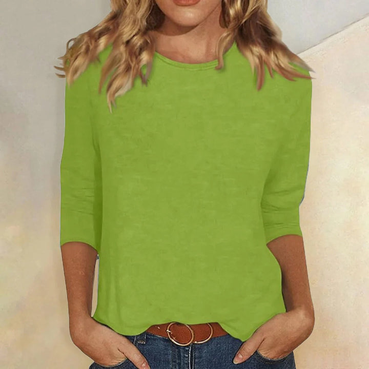 Model wearing a comfortable women's relaxed fit 3/4 sleeve crew neck top for everyday casual style.