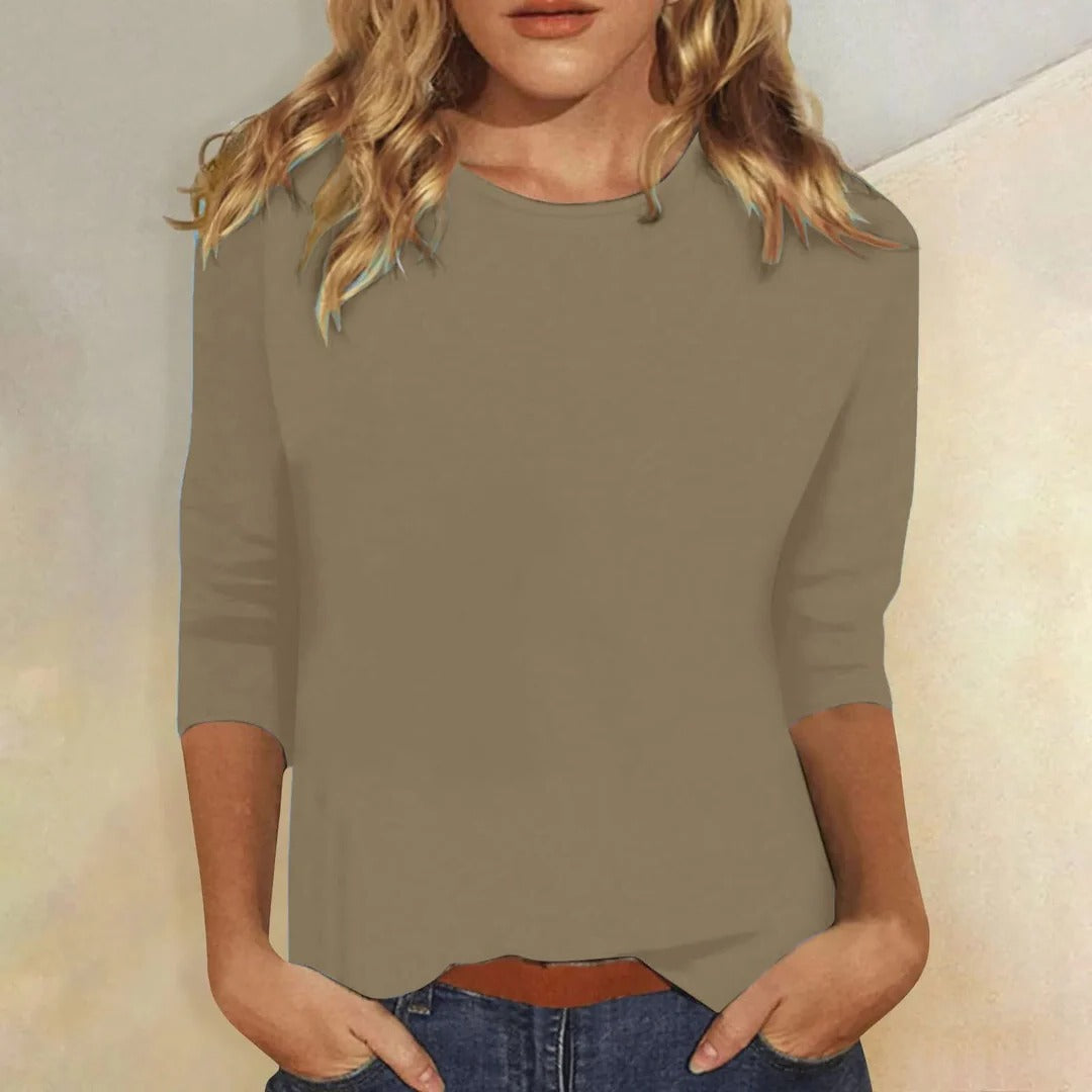 Soft women's 3/4 sleeve crew neck top, designed with a relaxed fit for ultimate comfort and versatility.