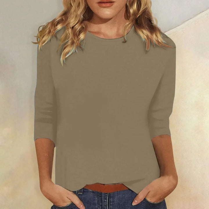 Soft women's 3/4 sleeve crew neck top, designed with a relaxed fit for ultimate comfort and versatility.