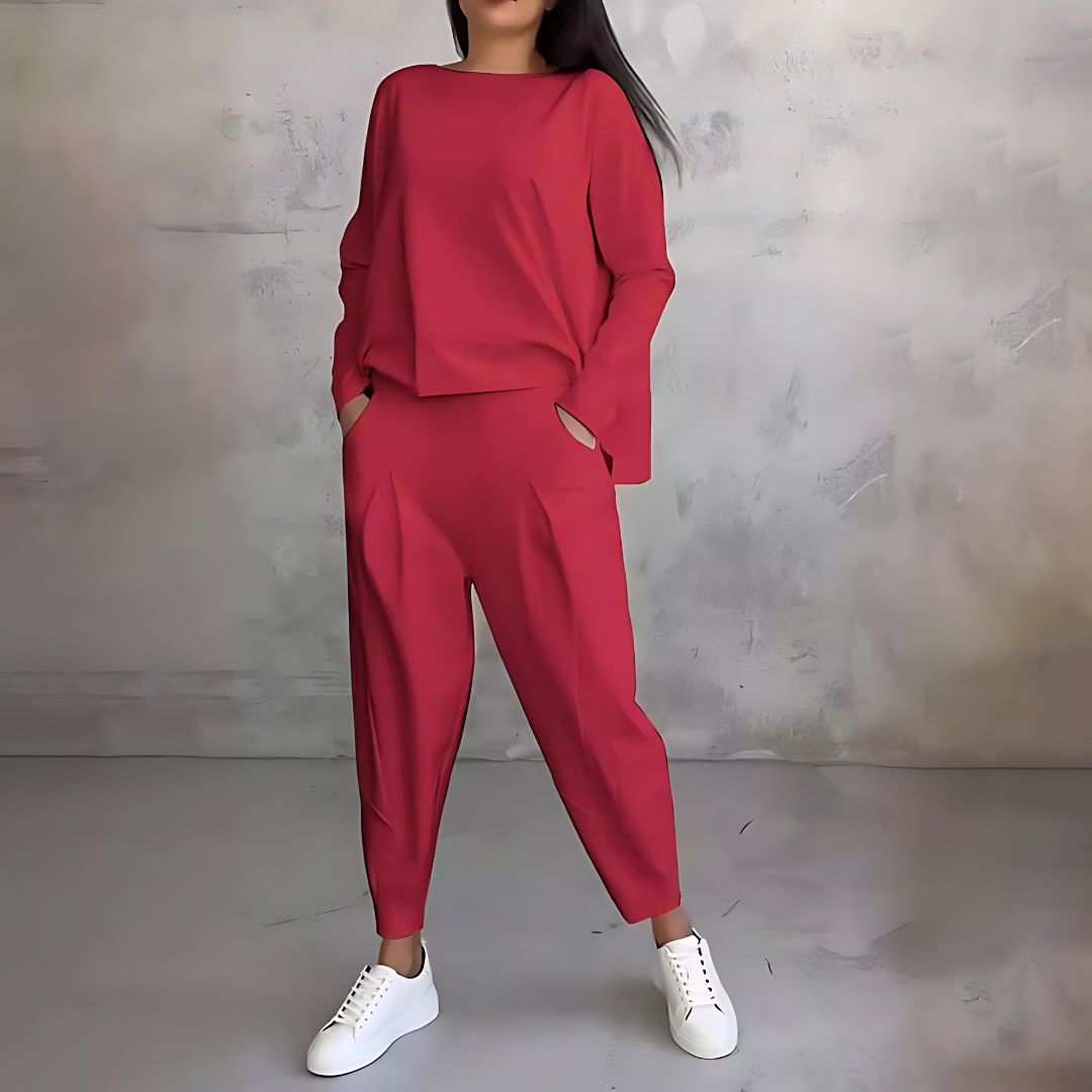 Matching lounge wear set for women featuring a long sleeve loose-fit top and stylish tapered pants.