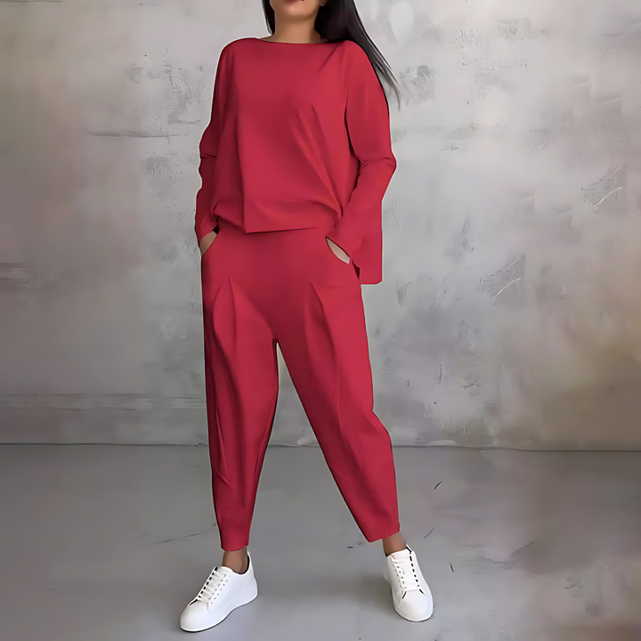 Matching lounge wear set for women featuring a long sleeve loose-fit top and stylish tapered pants.