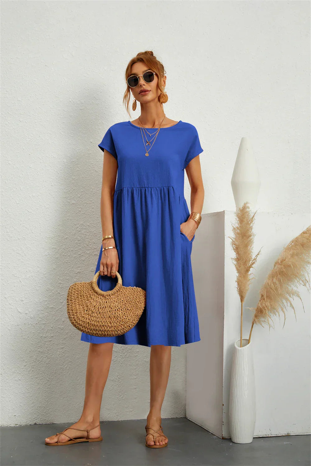 Trendy women's casual midi dress with pockets, short sleeve, and tiered design for effortless fashion.