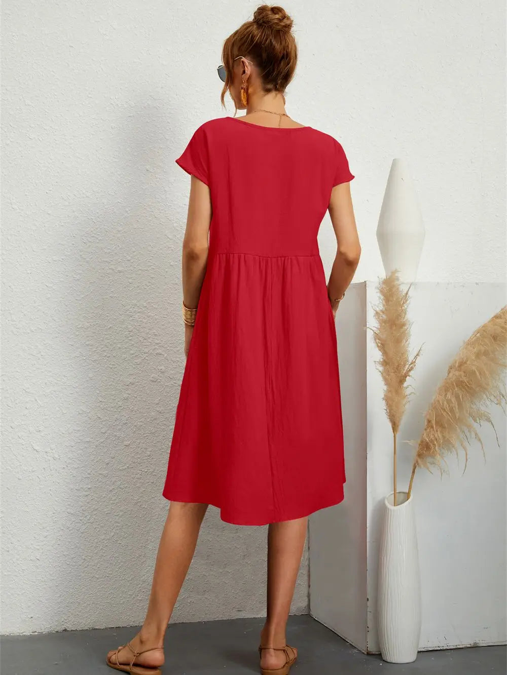 Red casual midi dress for women, featuring short sleeves and practical side pockets.