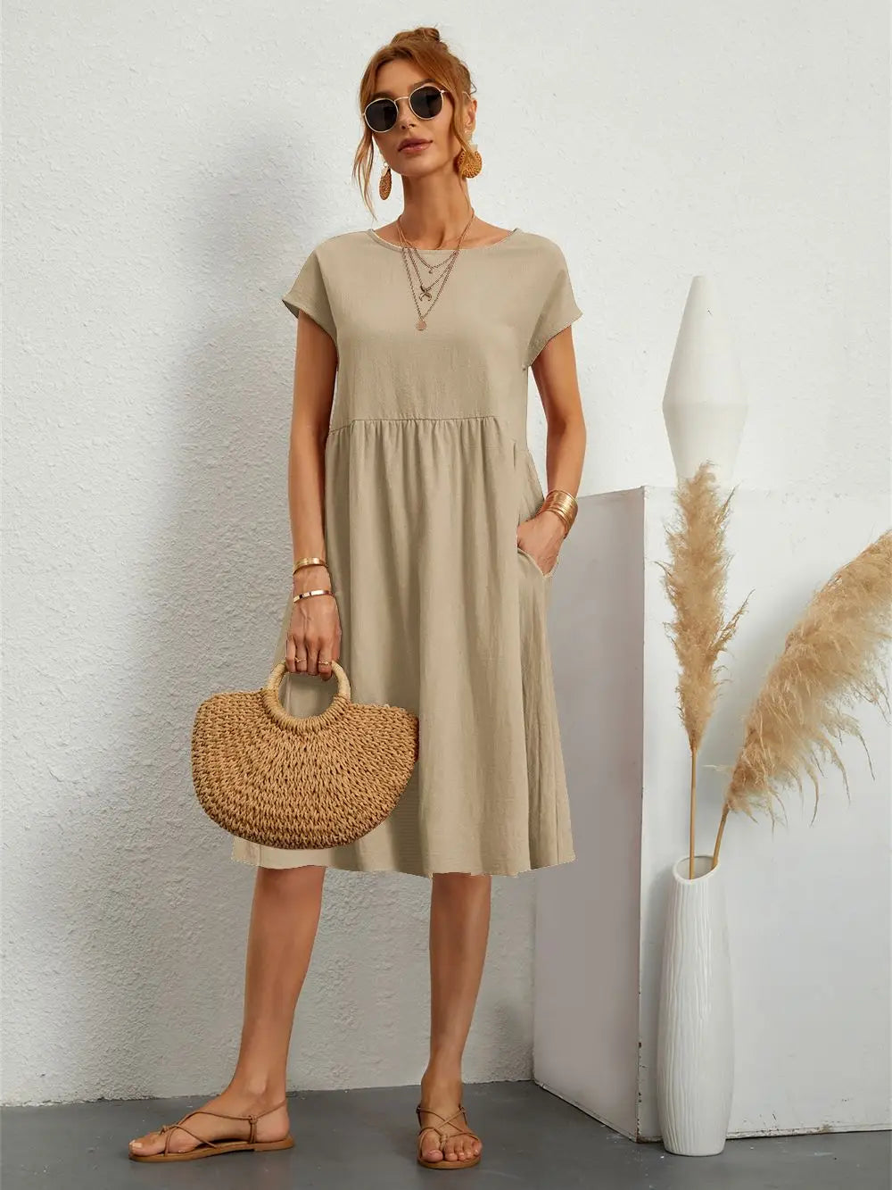 Versatile women's casual midi dress with short sleeves & pockets, ideal for everyday summer style.