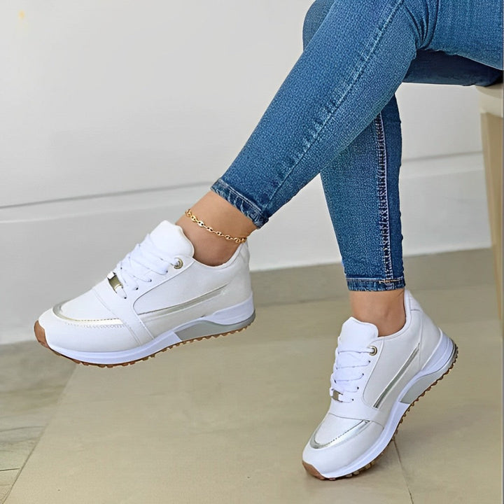 Stylish women's athletic-style sneakers with non-slip sole, designed for casual walking and support